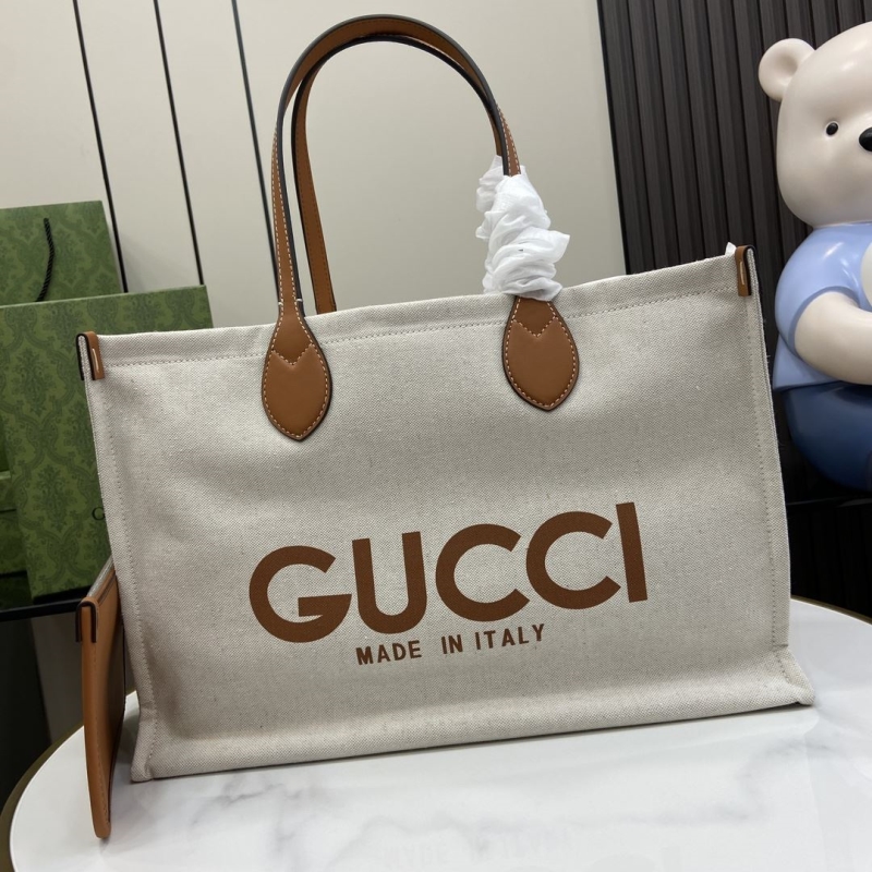 G*u*i shopping bags